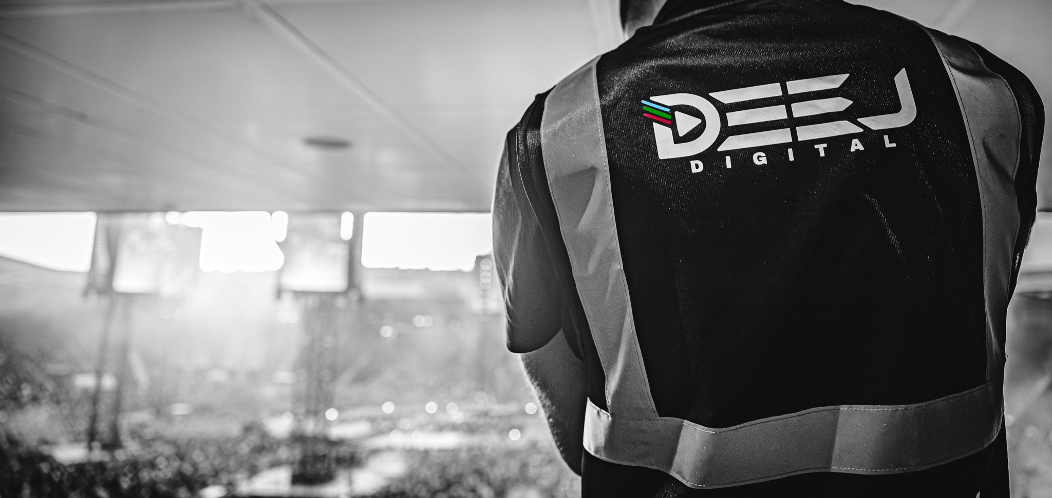 DeeJ Digital event media vest overlooking a live stadium environment